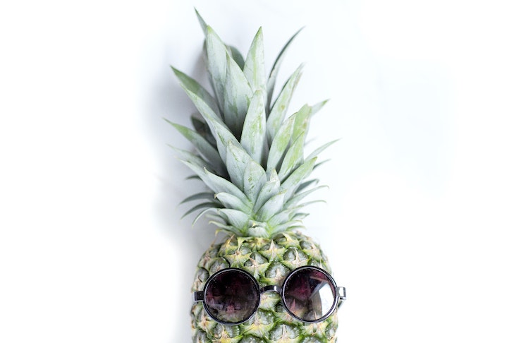 Photo of a pineapple with sunglasses